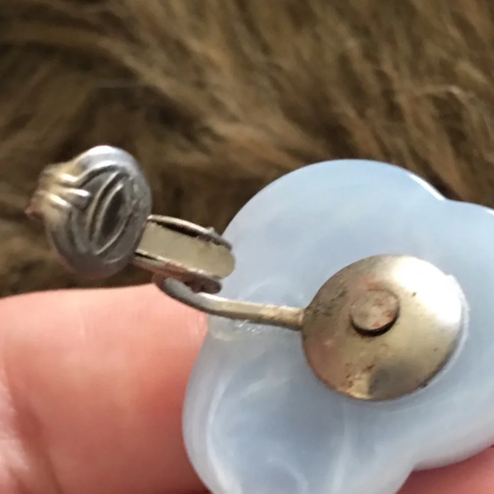 Vintage 70s light blue plastic swirl clip earrings